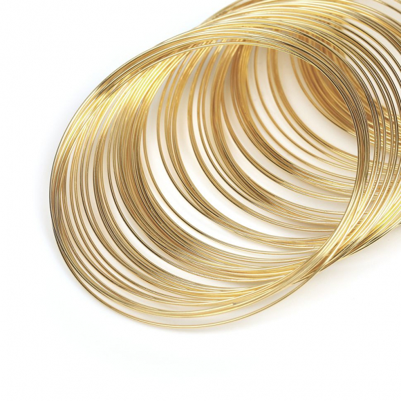 Проволока с Памятью "Мемори" стальная для браслетов ?0,6мм арт.ТВ HET-17 цв.светлое золото 100 витков